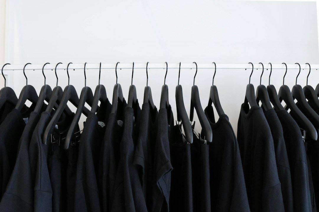 Clothes hanging together on a wardrobe rail